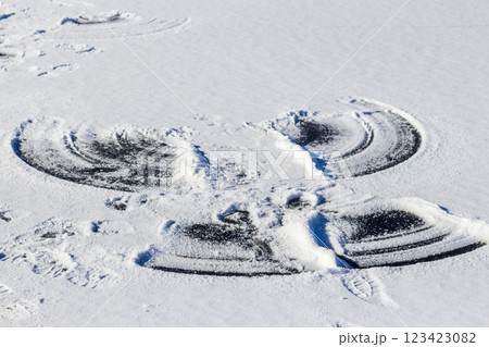 Print of a snow angel on the frozen lake. Fun Print of a snow angel on the frozen lake. Fun 123423082
