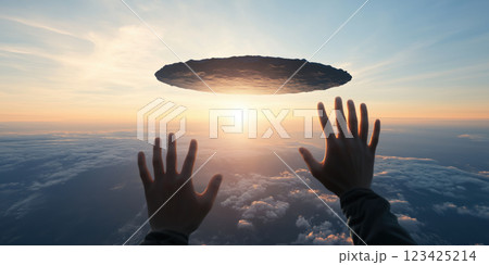 Hands reaching towards floating flat earth in sky at sunset 123425214