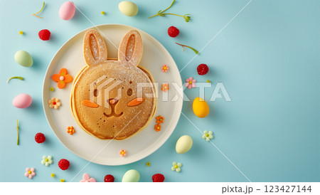 Easter-themed round pancakes decorated with bunny faces and colorful eggs 123427144