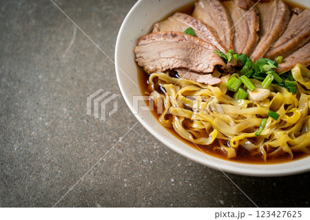 egg noodles with stewed duck in brown soup egg noodles with stewed duck in brown soup 123427625