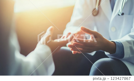 Doctor comforting patient in medical office, showing empathy and care, emphasizing importance of communication in healthcare 123427867