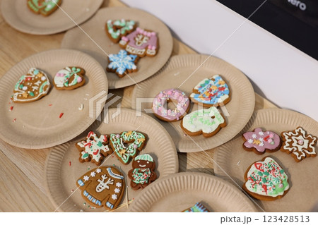 Plates of Gingerbread Cookies Decorated for the Festive Season and Holiday Celebrations Plates of Gingerbread Cookies Decorated for the Festive Season and Holiday Celebrations 123428513