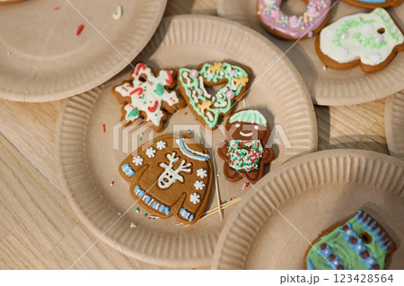 Deliciously Decorated Holiday Cookies Arranged Beautifully on Festive Paper Plates Deliciously Decorated Holiday Cookies Arranged Beautifully on Festive Paper Plates 123428564