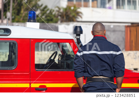 French firefighter next to a fire truck 123428851