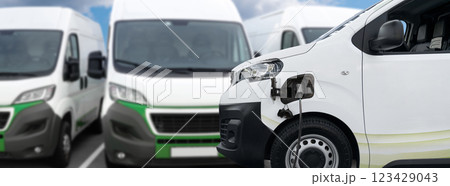 Electric delivery van with connected charging cable 123429043