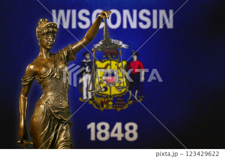 Lady Justice before a flag of Wisconsin 123429622