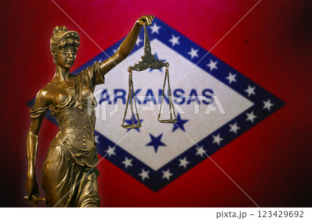 Lady Justice before a flag of Arkansas 123429692