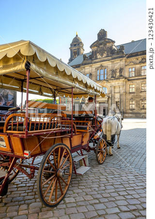 Horse drawn carriage, popular form of sightseeing for tourists visiting historic Old town district of Dresden, Saxony, Germany 123430421