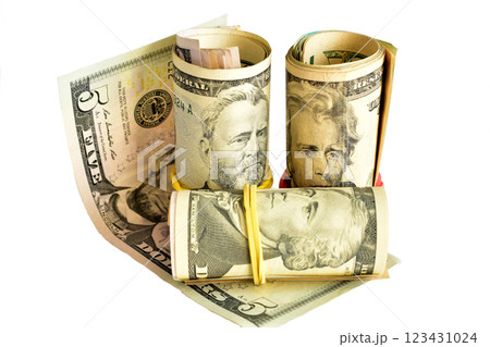American dollars of different denominations rolled into rolls. American dollars of different denominations rolled into rolls. 123431024