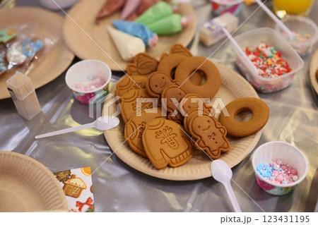 Delightful Festive Gingerbread Cookies topped with Colorful Decorations and Icing Galore Delightful Festive Gingerbread Cookies topped with Colorful Decorations and Icing Galore 123431195