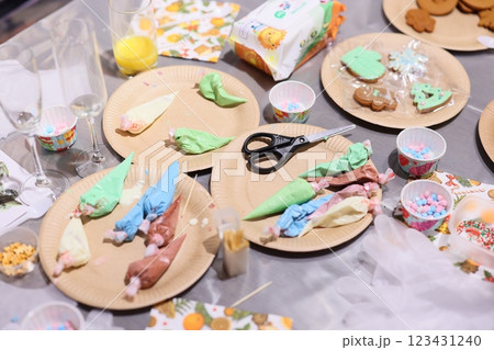 A Vibrantly Colorful Dessert Decorating Table Complete with Icing and Sweet Treats Galore 123431240