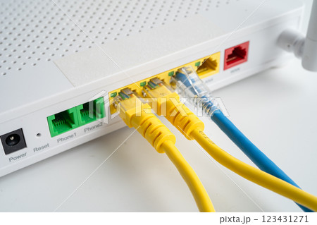 Ethernet cable with wireless router connect to internet service provider internet network. Ethernet cable with wireless router connect to internet service provider internet network. 123431271