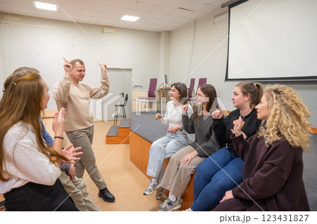 A group of young people talking in sign language. A group of young people talking in sign language. 123431827