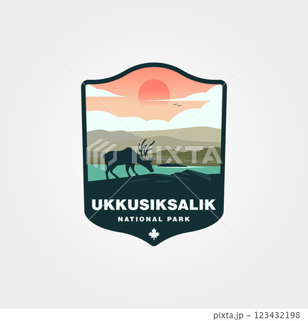 Here is a twelveword sentence describing the provided image without using the prohibited words A caribou drinks by water under a setting sun in Ukkusiksalik National Park. 123432198