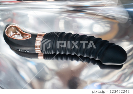 Sex toy on metal background. Sex toy on metal background. 123432242
