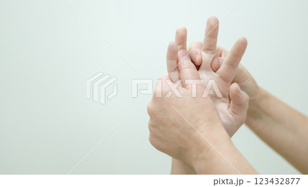 Close-up of female hands during massage.  Close-up of female hands during massage.  123432877