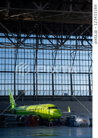 Airplane undergoing repairs in a hangar. Airplane undergoing repairs in a hangar. 123433169