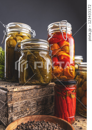 Variety of pickles in glass jars Variety of pickles in glass jars 123433172