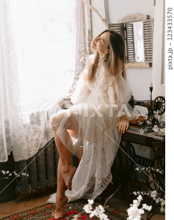 Gorgeous woman wearing vintage pastel dress. Spring fashion or beauty concept 123433570