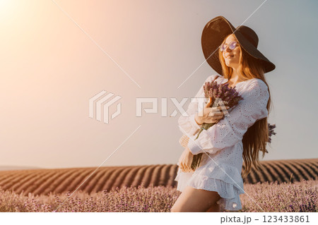 Woman in White Dress and Hat in Lavender Field Woman in White Dress and Hat in Lavender Field 123433861