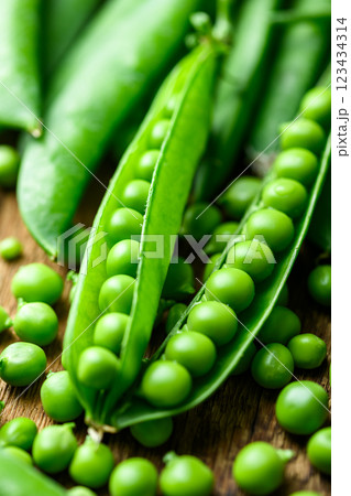 Green sugar snap peas with pods close up Green sugar snap peas with pods close up 123434314