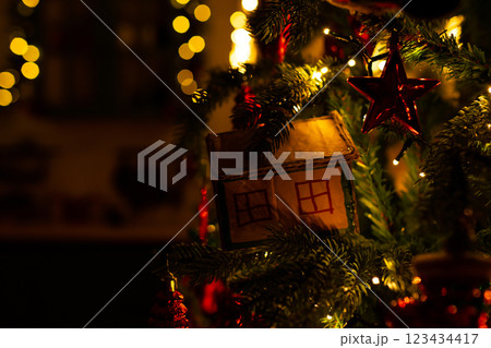 New Year's toys on the Christmas tree made by yourself. Christmas decorations made from cardboard. 123434417