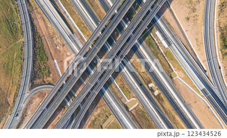 Drone shot aerial view of high angle view of intersection across the bridge against the countryside highway Drone shot aerial view of high angle view of intersection across the bridge against the countryside highway 123434526
