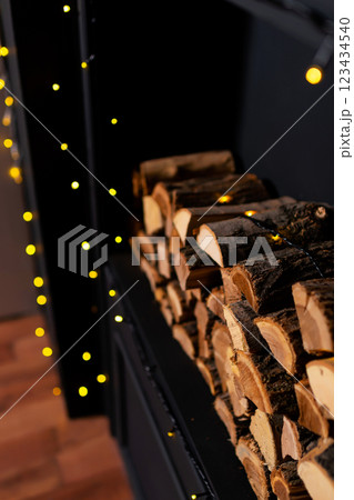 real logs for kindling the Christmas stove. logs in the fireplace 123434540