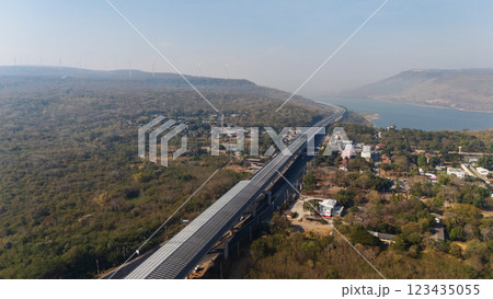 Drone shot aerial view landscape of the M6 motorway Expressway Nakhon Ratchasima Province - Bang Pa-in. Lam Ta Khong River and Mountain. Drone shot of scenic landscape rural place traffic. Nakhon Drone shot aerial view landscape of the M6 motorway Expressway Nakhon Ratchasima Province - Bang Pa-in. Lam Ta Khong River and Mountain. Drone shot of scenic landscape rural place traffic. Nakhon 123435055