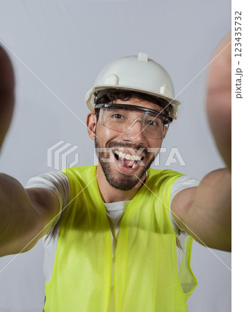 Funny builder engineer taking a selfie isolated, Engineer taking a selfie isolated. View of male engineer taking a selfie isolated, Smiling male engineer taking a selfie looking at camera Funny builder engineer taking a selfie isolated, Engineer taking a selfie isolated. View of male engineer taking a selfie isolated, Smiling male engineer taking a selfie looking at camera 123435732