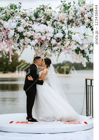wedding ceremony of the newlyweds on the pier 123436644