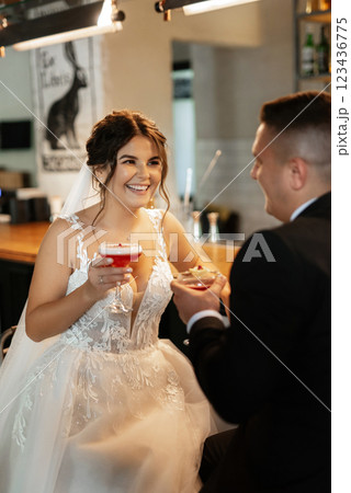 bride and groom inside a cocktail bar bride and groom inside a cocktail bar 123436775