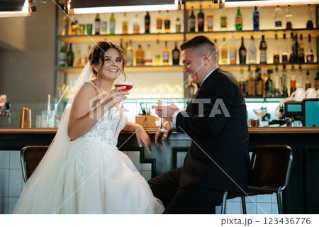 bride and groom inside a cocktail bar bride and groom inside a cocktail bar 123436776