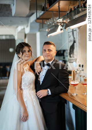 bride and groom inside a cocktail bar 123436784