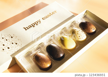 A box of chocolate eggs with the inscription in English Happy Easter. A box of chocolate eggs with the inscription in English Happy Easter. 123436931