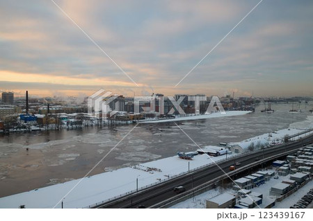 A winter scene with a snowy river landscape, harmoniously blending industrial elements A winter scene with a snowy river landscape, harmoniously blending industrial elements 123439167