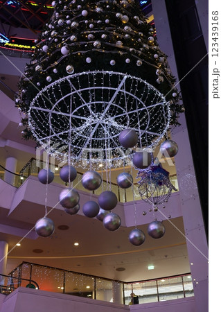 Experience the vibrant holiday decorations in the modern mall that enhance the seasons joy 123439168