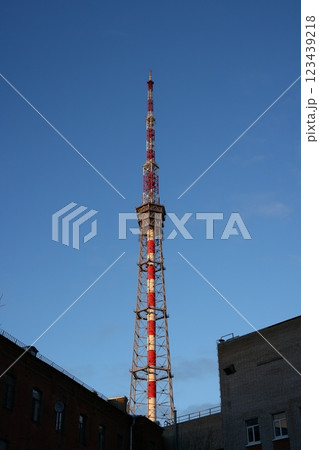 A Broadcast Tower Stands Tall Against a Bright Clear Blue Sky, Symbolizing Modern Communication A Broadcast Tower Stands Tall Against a Bright Clear Blue Sky, Symbolizing Modern Communication 123439218