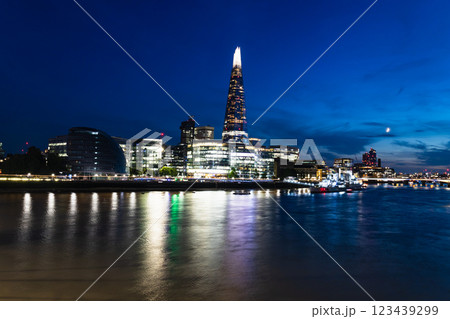 The Shard Illuminated at Night with Thames River Reflections in London Skyline The Shard Illuminated at Night with Thames River Reflections in London Skyline 123439299