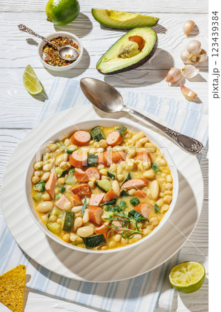white bean chickpea chili with sausages, zucchini white bean chickpea chili with sausages, zucchini 123439384