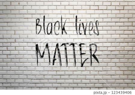 Black Lives Matter sprayed on a white faience wall of a subway station Black Lives Matter sprayed on a white faience wall of a subway station 123439406