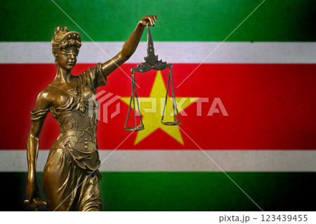 Lady Justice before a flag of Suriname Lady Justice before a flag of Suriname 123439455