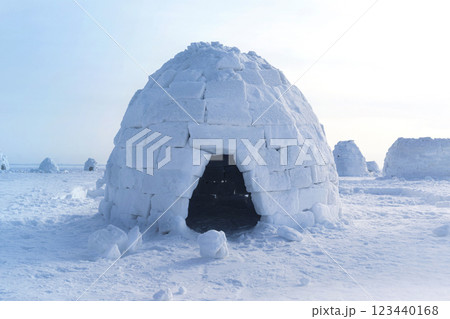 Igloo holiday. Eskimo dwelling made of ice and snow. Igloo home from snow photo Igloo holiday. Eskimo dwelling made of ice and snow. Igloo home from snow photo 123440168