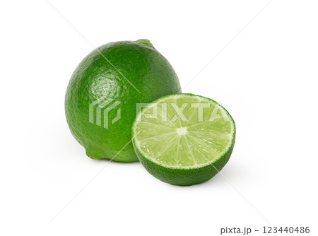 Whole fresh lime and a slice isolated. Whole fresh lime and a slice isolated. 123440486
