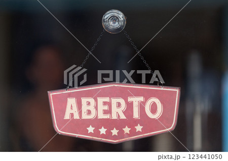 Open sign written in Portuguese 123441050