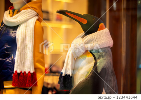 A funny toy penguin is wrapped in a warm scarf. A funny toy penguin is wrapped in a warm scarf. 123441644