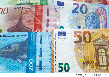 Stack of Norwegian krone and Euros 123442833