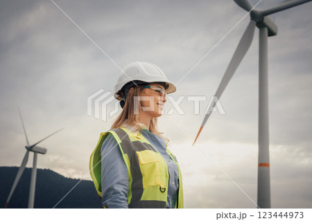 A Female Engineer working at a Wind Energy Facility is making significant strides in empowering innovative renewable energy solutions, contributing to a more sustainable and ecofriendly future 123444973