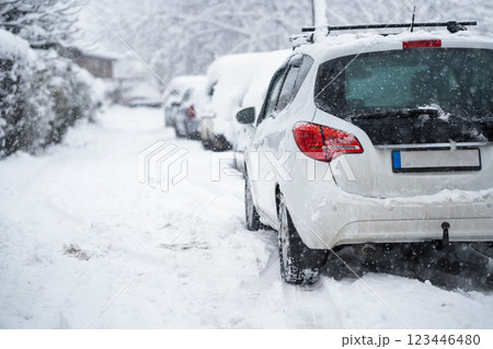 Parked car covered with snow during snow storm 123446480