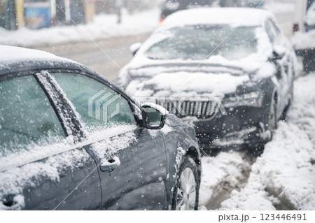 Parked car covered with snow during snow storm 123446491
